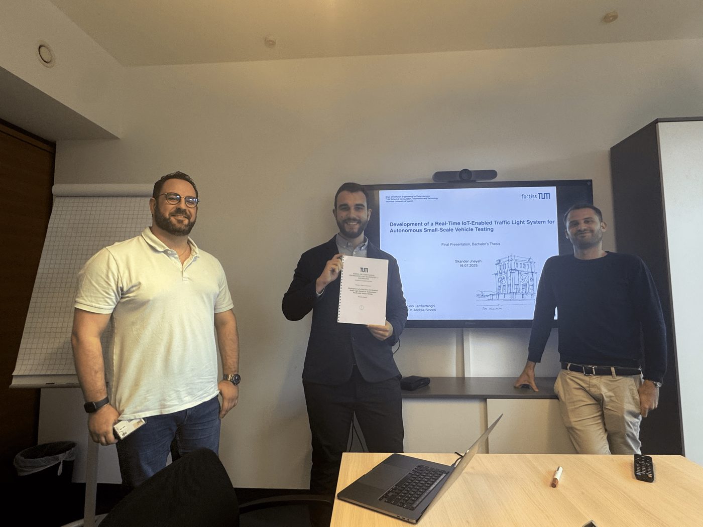 Skander Jneyeh presenting his bachelor's thesis alongside Stefano Carlo Lambertenghi and Andrea Stocco